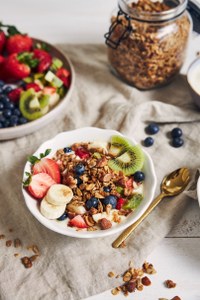 bowls-granola-with-yogurt-fruits-berries-white-surface_200x300